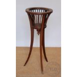 An Edwardian inlaid mahogany jardiniere stand / planter,