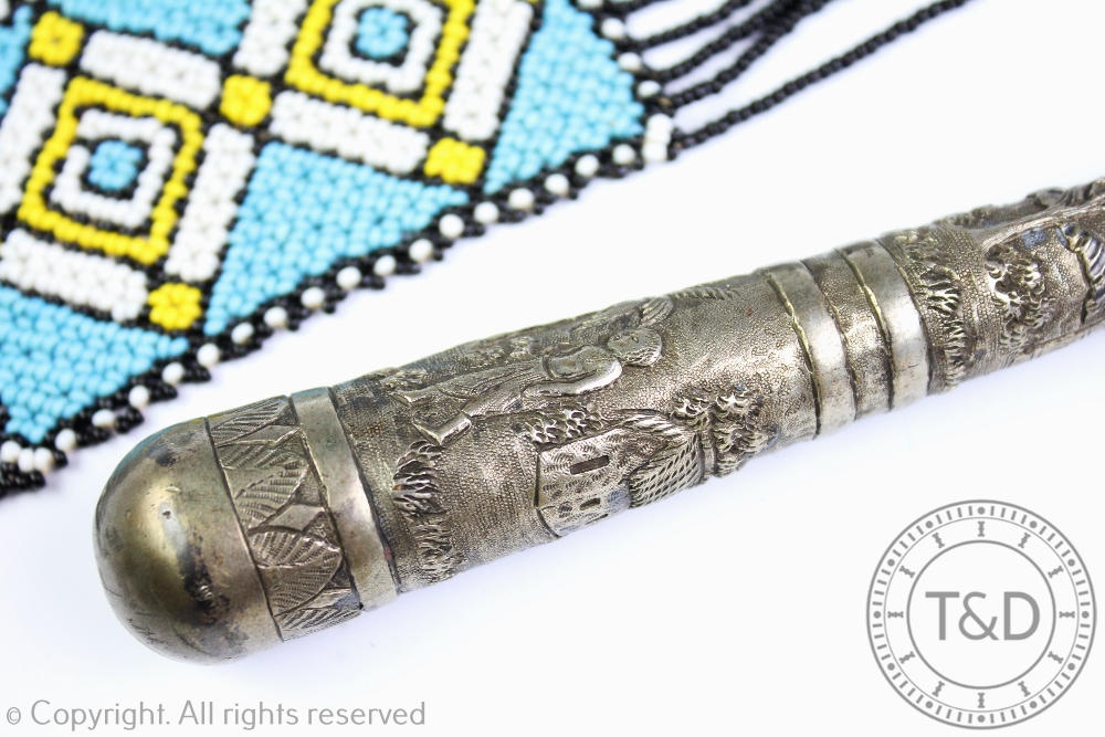 A Burmese silver parasol handle of tapering form and depicting figures amongst huts and palm trees, - Image 2 of 2