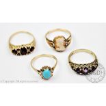 An amethyst set 9ct gold ring, a garnet set 9ct gold ring,