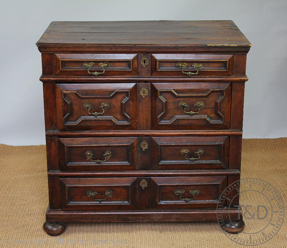 An early 18th century century and later Jacobean style oak chest,