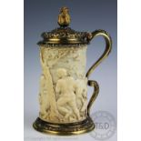 An Austro Hungarian silver gilt and carved ivory tankard, Stephan Mayerhofer, Vienna 1835,