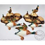 A set of three Beswick wall plaques, each modelled as graduating ducks,