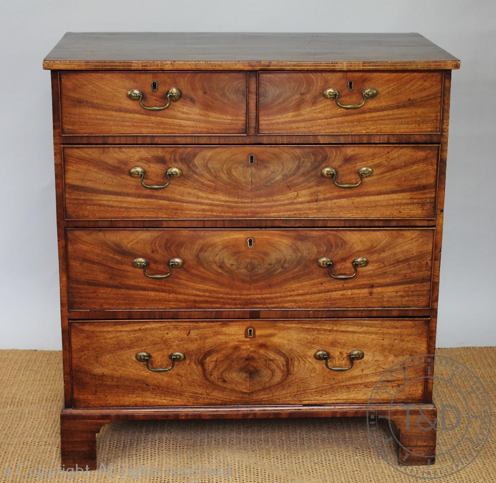 A George III mahogany chest, with two short and three graduated long drawers, with pine side panels,