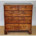 A George III mahogany chest, with two short and three graduated long drawers, with pine side panels,