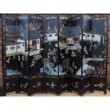 A Chinese lacquered eight fold room screen, of large proportions,