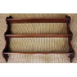 A mahogany three tier hanging shelf, with serpentine sides, 75cm H x 95cm W,