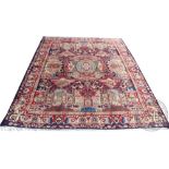 A Persian hand woven wool carpet, elaborately designed with an 'under earth' type pattern,