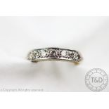 A diamond set half eternity ring,