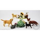 A collection of Beswick animals comprising; a yellow Labrador, 12cm long, a Rottweiler, 9cm long,