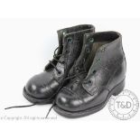 A pair of hand made children's black leather boots,
