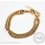 A yellow metal double watch albert chain,