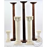 Three milliners oak hat display stands, with fluted columns, on square bases, 61cm H,