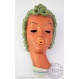 An Art Deco KWK Keramos Austrian terracotta wall mask,