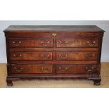 A George III oak and mahogany cross-banded mule chest, with hinged top above two dummy drawers,