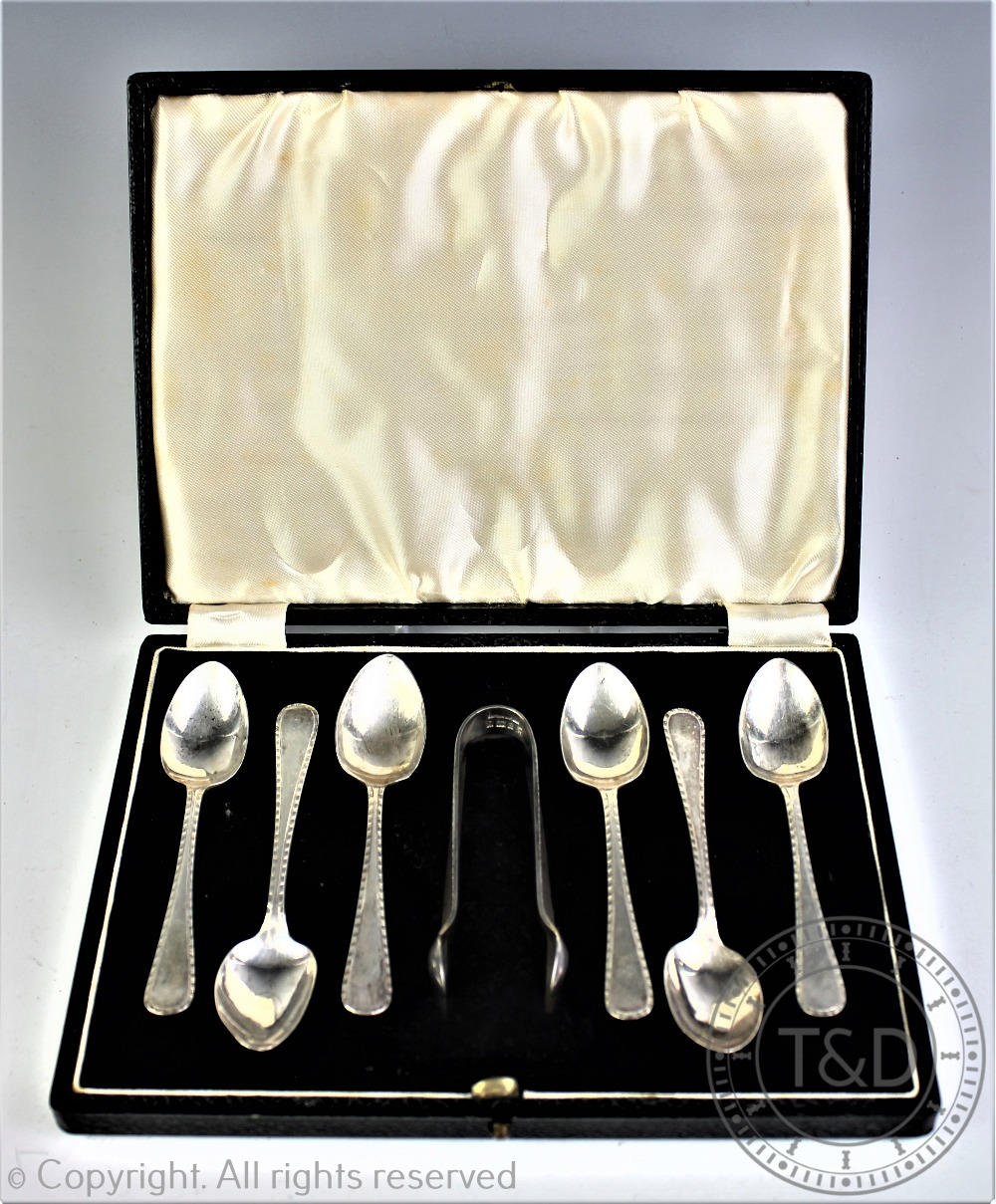 A cased set of six silver teaspoons and sugar tongs, Barker Brothers Silver Ltd, Birmingham 1958,