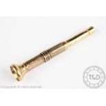 A 9ct yellow gold cigar piercer Chester 1927, with engine turned detail, gross weight 15.