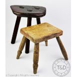 A late 19th century stained pine milking stool, 30cm H,