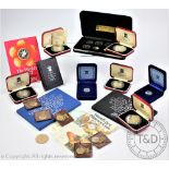 A selection of Pobjoy silver proof coins, comprising a 1980 Isle of Man decimal coinage set,