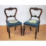 A set of six William IV carved rosewood dining chairs,