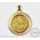 An Edward VII gold sovereign dated 1902, within a 9ct yellow gold pendant mount, gross weight 10.