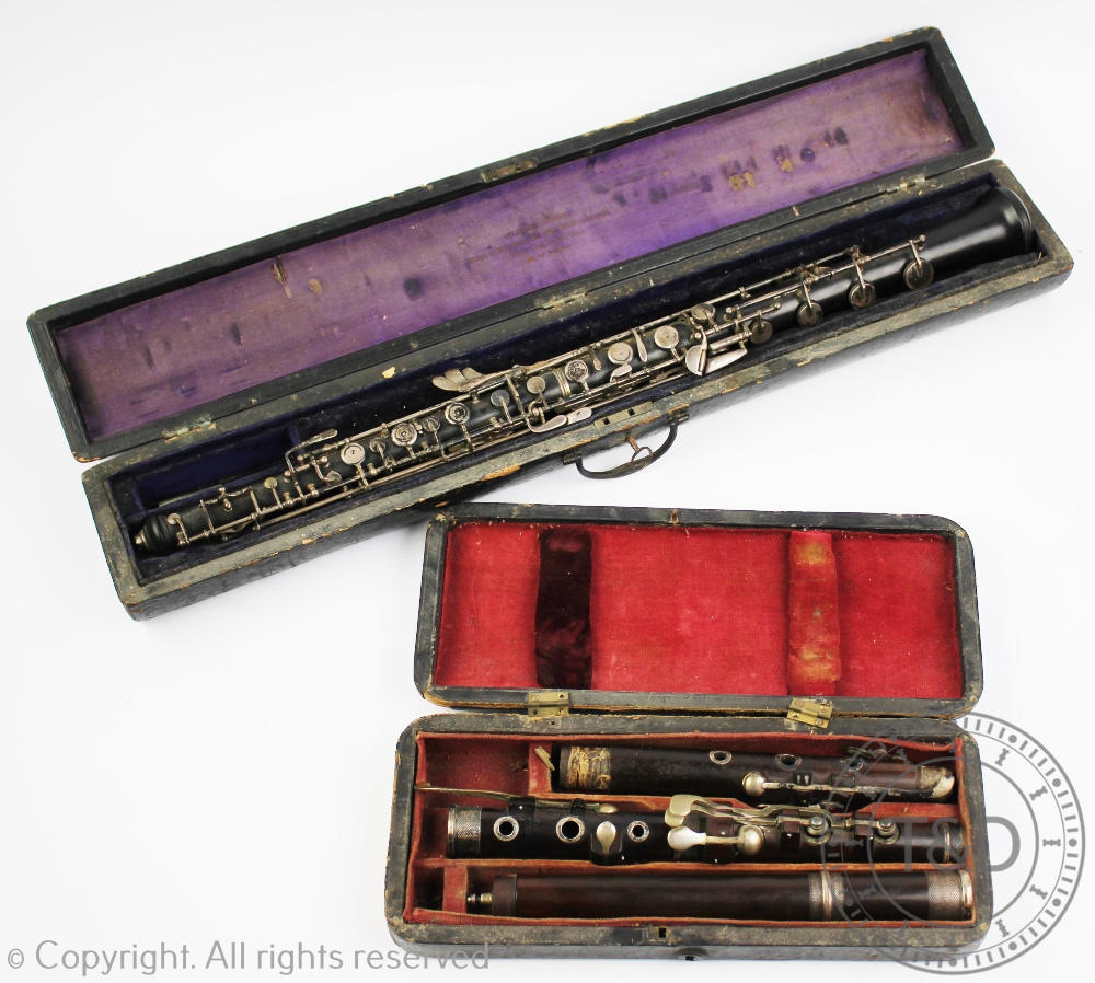 A 19th century rosewood flute by J Wallis, 135 Euston Road, with plated fittings,