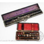 A 19th century rosewood flute by J Wallis, 135 Euston Road, with plated fittings,