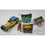 Two tin plate clockwork toys comprising;