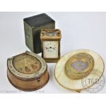 A 19th century lacquered brass French timepiece, white dial with black Roman numerals,