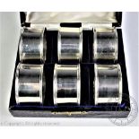 A cased set of six American silver napkin rings, each circular napkin ring initialled 'P', 4.