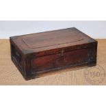An early 20th century campaign style teak trunk, with chamfered panels,
