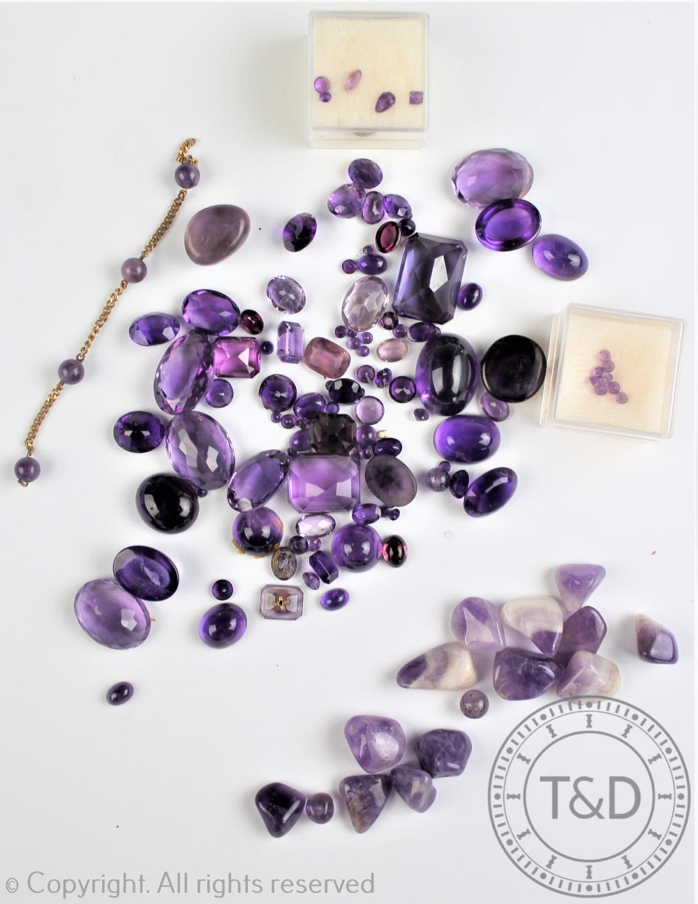 A collection of un-mounted quartz gemstones, to include; amethyst,