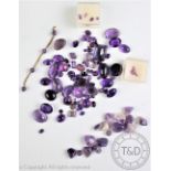 A collection of un-mounted quartz gemstones, to include; amethyst,