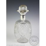 A George V silver mounted cut glass decanter and stopper, Sheffield, 1932, with four pouring lips,