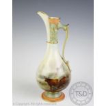 A Royal Worcester ewer by J Stinton, decorated with cattle watering and signed,