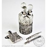An Edwardian silver mounted set of three cut glass scent bottles and stoppers, Collyer & Co,