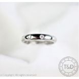 A platinum and diamond set eternity ring,