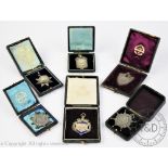 A selection of six silver and white metal sporting presentation fobs and club medals all awarded to