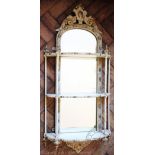 A Regency style mirror back gilt wood and gesso hanging shelf,