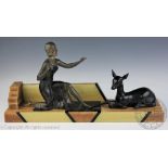 An Art Deco spelter group of a lady and a deer, on marble base, 57.