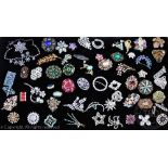 A collection of assorted vintage and costume brooches and suites of jewellery,