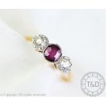 An untested ruby and diamond three stone ring,