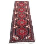 A Persian hand woven wool Lori type runner, worked with five gulls,