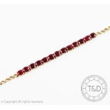 An untested ruby set line bracelet, set with thirteen oval rubies,