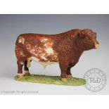 A Shebeg Shorthorn bull, modelled on a grassy verge plinth base,