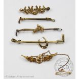 A collection of five brooches, to include; three gold examples a hunting example,