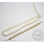 An untested pearl and gold coloured bead bracelet, with attached 14k gold clasp, 18.