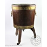 A George III style brass bound mahogany cellarette / coal bucket, with lion mask brass handles,