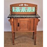 An Edwardian pine wash stand, with marble top and raised back inset with four Art Nouveau tiles,