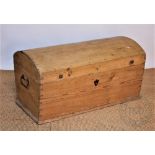 A pine domed top blanket box, with loop handles,