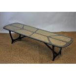 A 1960's long oval coffee table,